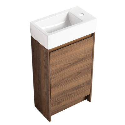 Meuble-lavabo autoportant de 18 po avec lavabo simple. Armoire avec portes à fermeture en douceur. Bassin en céramique robuste. Contreplaqué d'ébène brun pour les petites salles de bain. Caractéristique silencieuse de 18 po. Salle de bain fiable