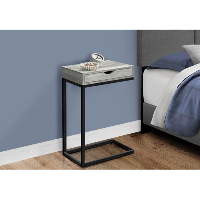 Table moderne avec stratifié gris - support en métal noir et rangement pour la base de la chambre à coucher qui ajoute du charme au salon