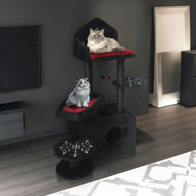 Arbre à chat multi-niveaux gothique avec poteaux à griffer, perchoirs, hamac et caverne pour chats d'intérieur.