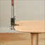 Table basse en chêne massif avec tablettes ouvertes doubles