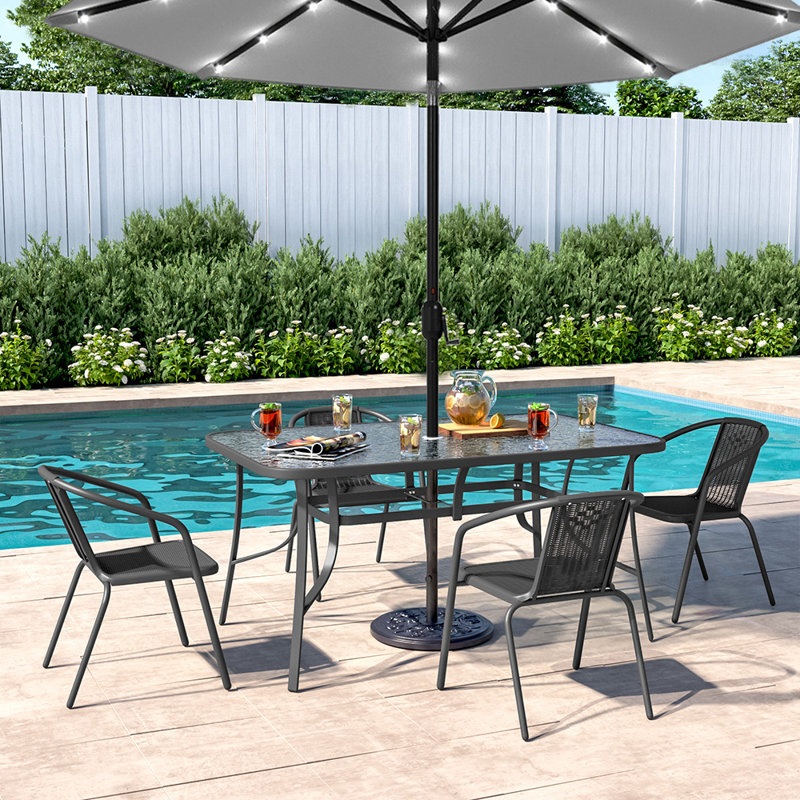 Donlon 4 - Person Patio Dining Set with Rectangular Table, Black/Grey