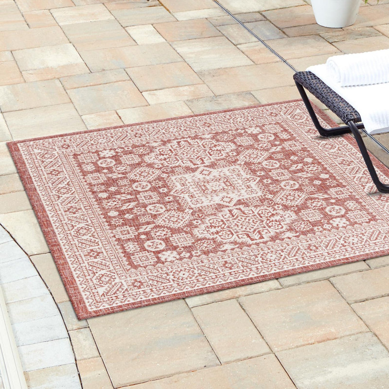 Archange Southwestern Machine Woven Rectangle 10' x 14' Polypropylene Indoor / Outdoor Area Rug in Rust Red