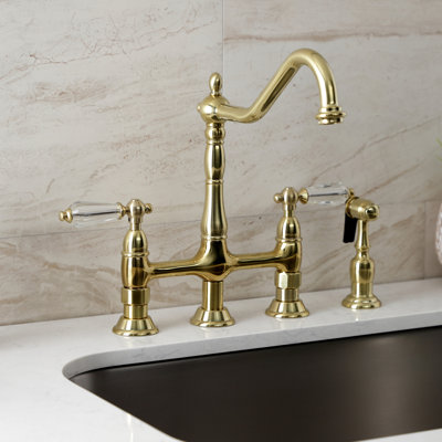 Kingston Brass Wilshire Two-Handle 4-Hole Deck Mount Bridge Kitchen Faucet with Side Sprayer