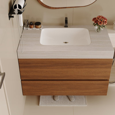 Meuble-lavabo suspendu de 76 cm (29,9 pouces) avec comptoir en pierre frittée aspect pierre claire, lavabo encastré en céramique, armoire en contreplaqué et deux tiroirs à fermeture douce, idéal pour les petites salles de bain, les appartements et les salles d'eau.