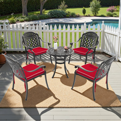 Ensemble de salle à manger de patio 5 pièces, table ronde de 68 cm avec trou pour parasol et 4 chaises empilables avec coussins rouges