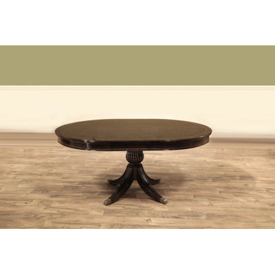 Round Walnut Dining Table With Self-storing Leaf Seats 2-4