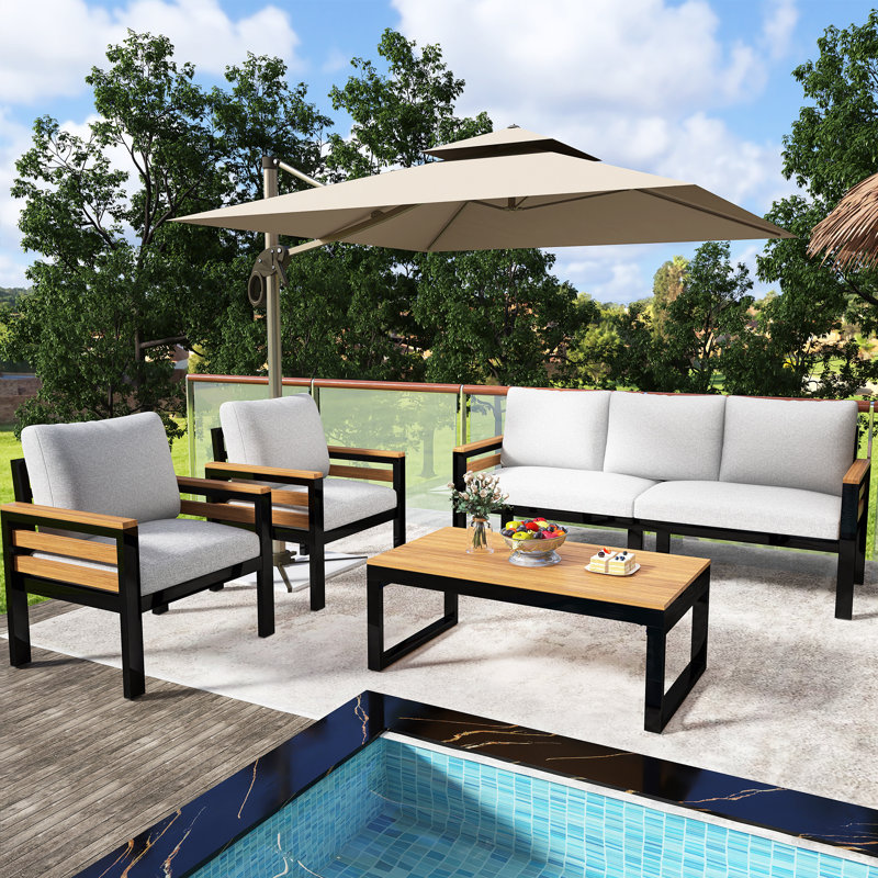 Ensemble de conservation de patio en bois 4 pièces avec accoudoirs en bois d'acacia, coussin amovible et table basse en bois massif