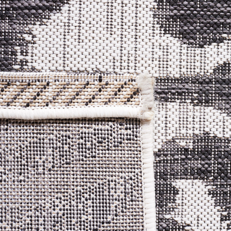 Ivory and Black Animal Print Indoor/Outdoor Rug