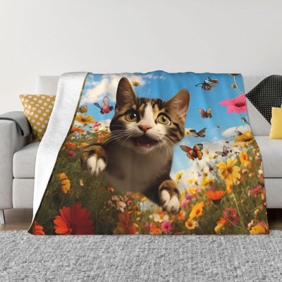 Couverture en laine imprimée chat sautant, idéale pour les voyages, les lits, les canapés et les fauteuils. Dimensions : 76 x 102 cm. Livrée avec un sac en toile imprimé chat.