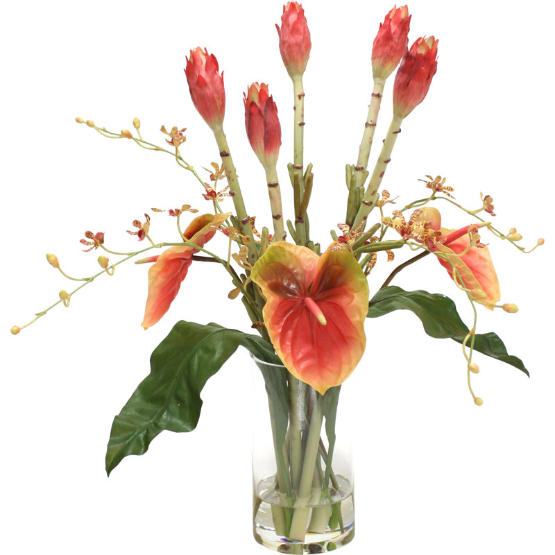 Mélange tropical dans un vase cylindrique en verre