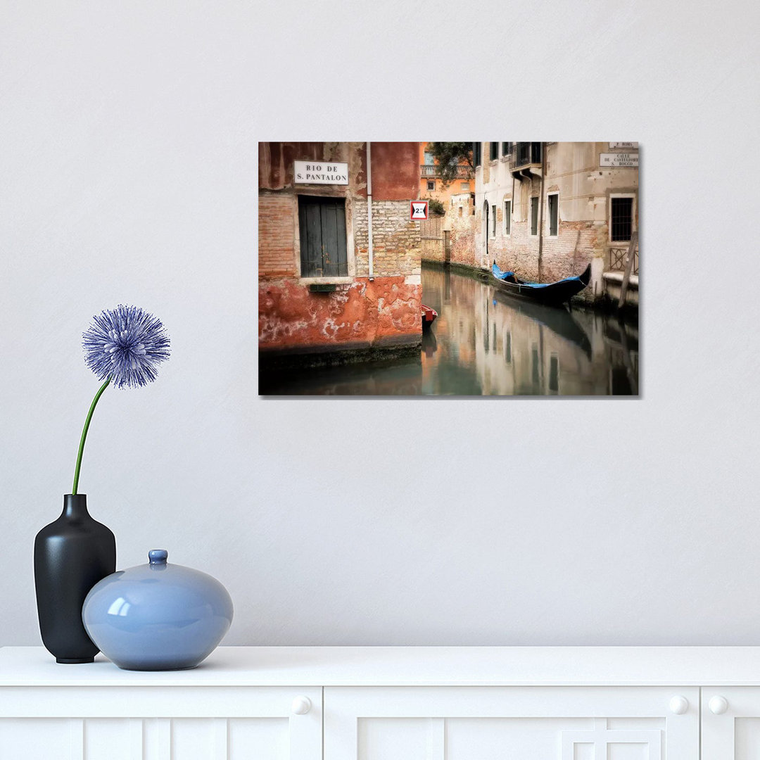 Italy, Venice. Gondola Moored In Canal. by Jaynes Gallery - Wrapped Canvas Print