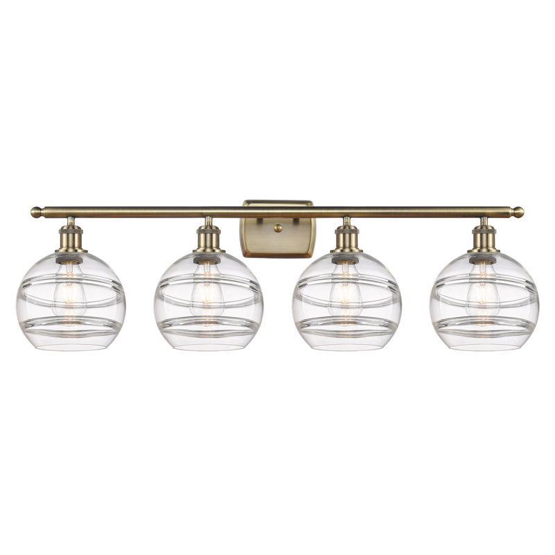 Éclairage pour meuble-lavabo à 4 lumières à intensité variable Chartoff, Transparent, Laiton antique