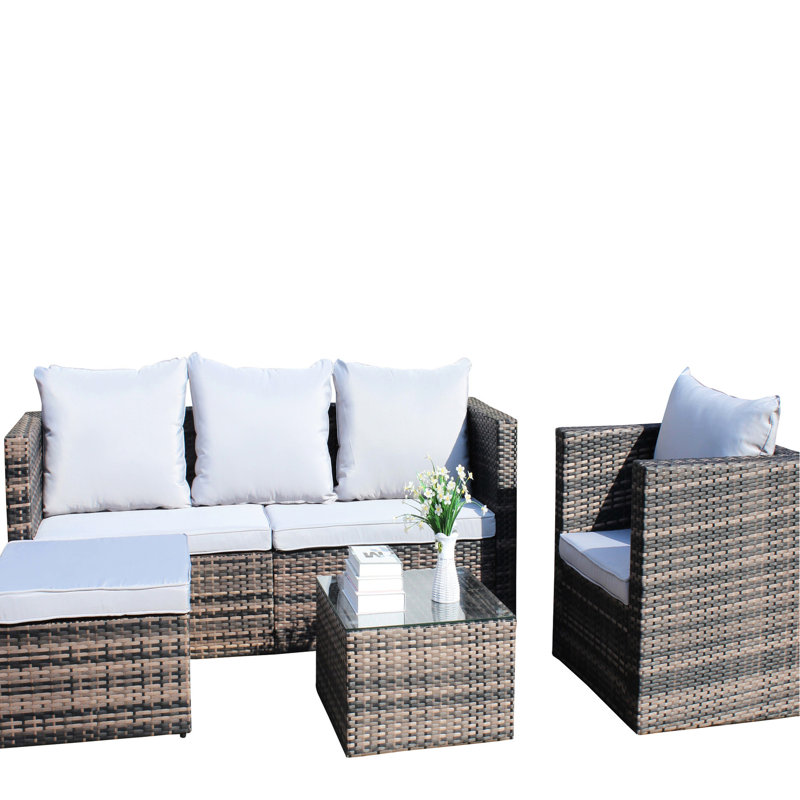 Mobilier d'extérieur pour 4 personnes: table basse en PE et coussins moelleux