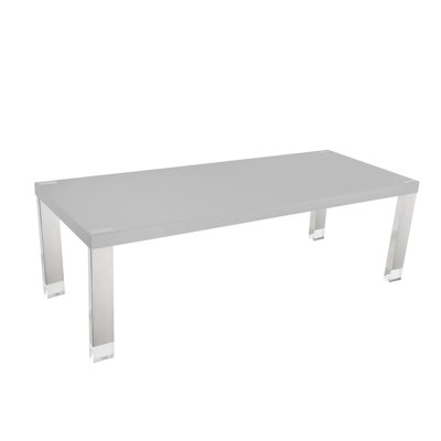 Table de salle à manger avec pieds en acier inoxydable et embouts en acrylique