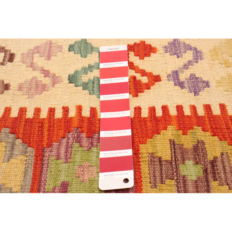 Tapis unique rouge de 4 pi 11 po x 6 pi 6 po Koeplin