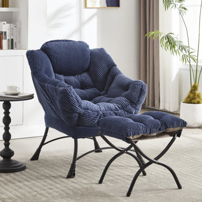 Fauteuil relax ergonomique bleu marine. Revêtement en coton moelleux et résistant. Poche latérale pour accessoires. Structure en acier. Repose-pieds confortable et moelleux. Confort optimal. Détendez-vous pleinement.