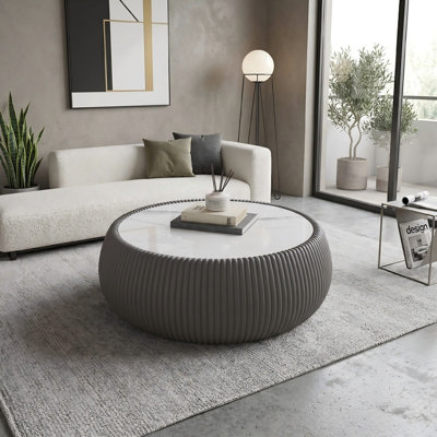Table basse ronde moderne en cuir de polyuréthane fritté avec dessus en pierre de polyuréthane pour le salon