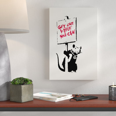 Get Out While You Can by Banksy - Wrapped Canvas Print