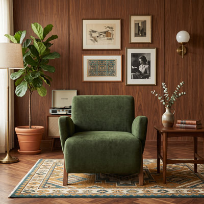 Fauteuil lounge en velours vert foncé, monobloc, design compact, mousse haute densité, pieds en bois massif, idéal pour le salon ou le bureau.