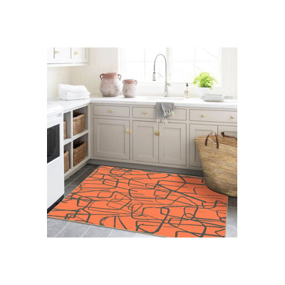Tapis orange lavé à la machine