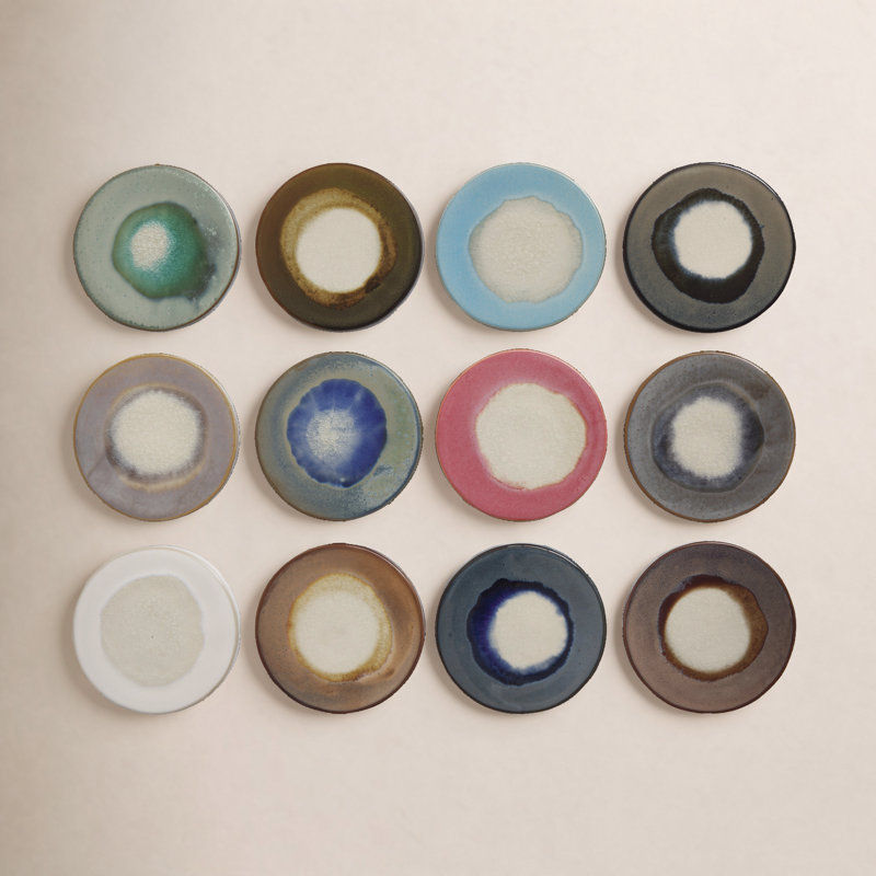 Ensemble de 12 sous-verres en grès réactif