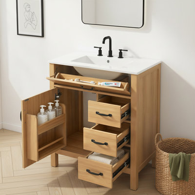 Meuble-lavabo de 76 cm avec lavabo en céramique, caisson en MDF, pieds en bois massif, 3 tiroirs et porte-accessoires.