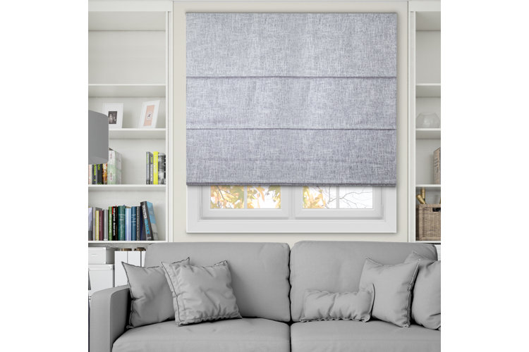 gray roman shade between white built ins