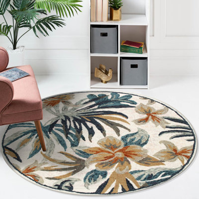 Tapis rond en laine touffeté à la main à motif floral bleu / orange / noir