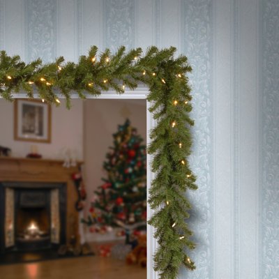 The Holiday Aisle® 9ft. North Valley Spruce Garland with Dual Color LED Lights
