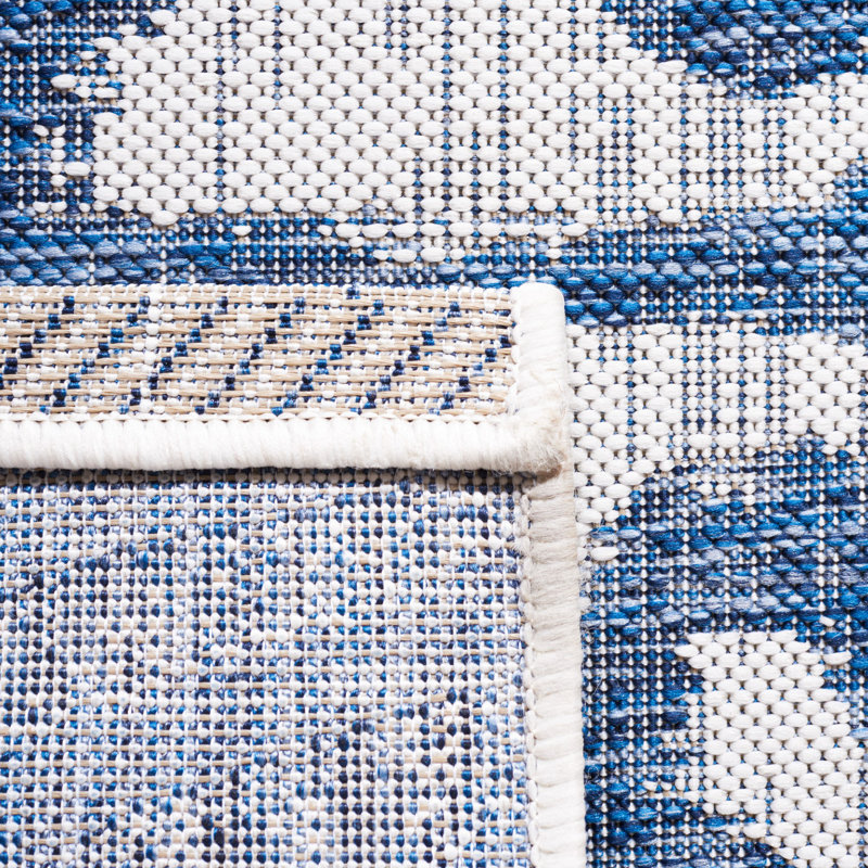 Ivory and Navy Animal Print Indoor/Outdoor Rug