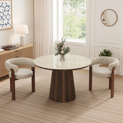 Ensemble de table et de chaises Adwin pour 2 personnes, comprenant une table ronde de 120 cm et 2 fauteuils rembourrés Teddy.