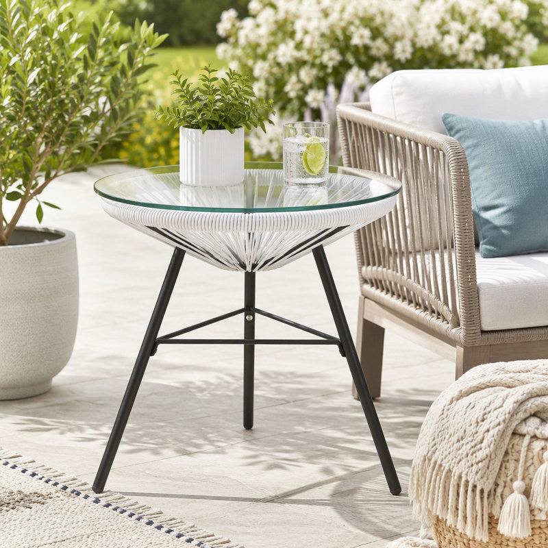 Table d'appoint d'extérieur en résine tressée avec plateau en verre trempé et motif soleil