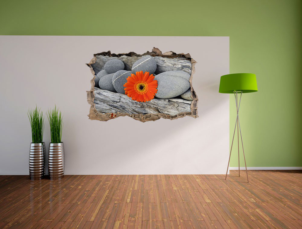 Orangefarbene Gerbera zwischen Zen-Steinen und Holz Wandsticker