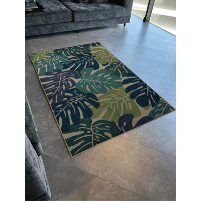 Tapis décoratif moderne et créatif avec un thème bleu-vert et des motifs de fleurs et de feuilles