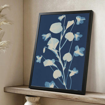 Modern Abstract Violets and leaves displayed in a monochromatic blue tone, Cyanotype photography style. 24" x 36" Framed Canvas Wall Art in Black Wood Fram