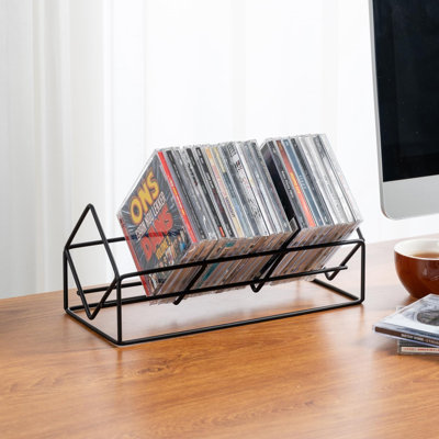 Support de rangement pour CD à 3 emplacements, capacité de 30 disques, en métal noir. Ce support compact à trois emplacements peut contenir jusqu'à 30 boîtiers de CD et des jeux vidéo.