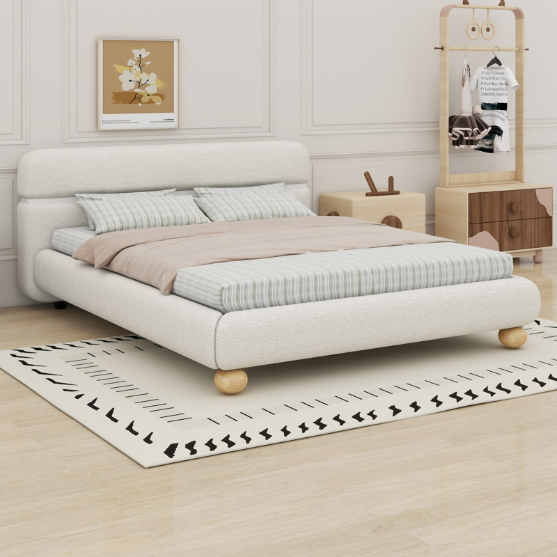 Lit tapissier contemporain à profil bas avec pieds ronds massifs et élégants pour la chambre à coucher