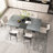 55.11" -70.86" Retro Rectangular Stretch Dining Table, Dark Gray Stone Top And Black Relief Plate Fine Sand Cross Iron Foot Base Dining Table, With Storage Box.-1911333494