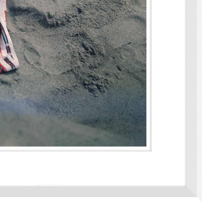 Pat Hall Lying on Beach Framed, 39" H x 33" W x 2.75" D, Brown