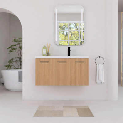 Meuble-lavabo mural 36 po avec lavabo en résine blanche, portes à fermeture en douceur