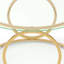 Table basse sculpturale moderne avec structure circulaire en métal
