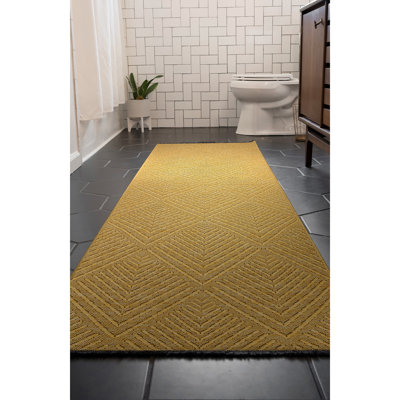 Tapis doré lavable à la machine Breneisha