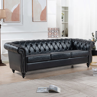 PU Rolled Arm Chesterfield Three Seater Sofa.
