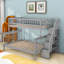 Lit superposé simple au dessus d'un lit double en bois avec escalier de rangement et garde-corps-899844231