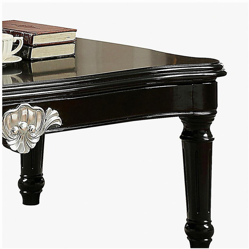 Table basse noire à pieds rotatifs