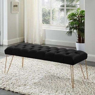 Banc en velours capitonné avec pieds dorés