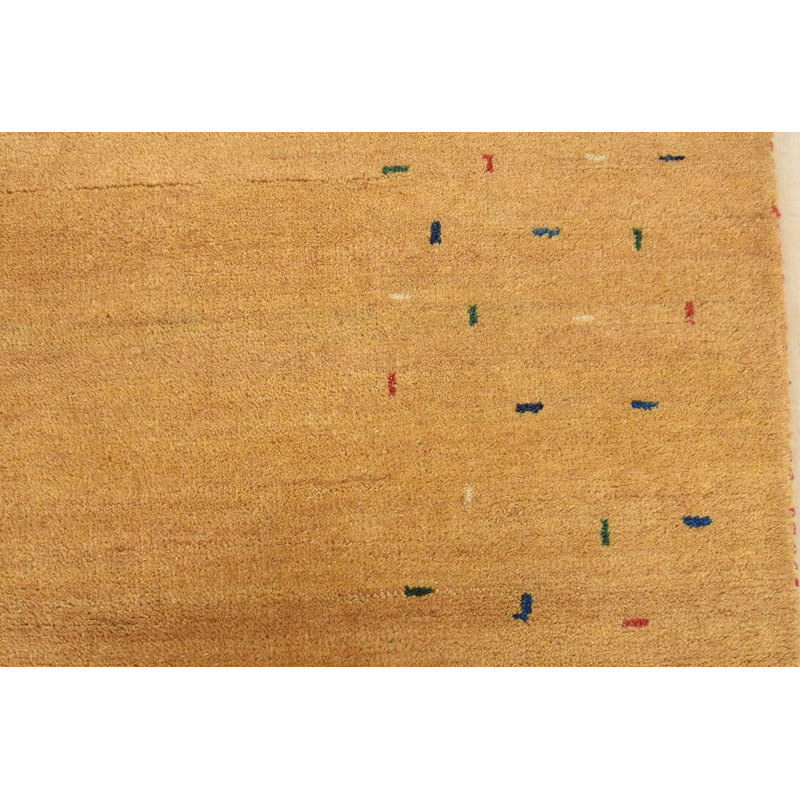 Tapis oriental doré en laine noué à la main