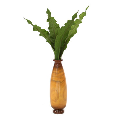 Plante de sol à feuilles en soie anthurium dans un vase décoratif