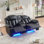 Causeuse inclinable électrique en similicuir 2 places avec console centrale Black Wave