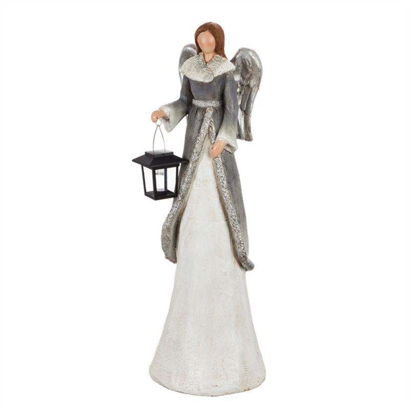 Statue d’ange d’hiver avec lanterne solaire